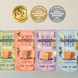 Lineup of Kiki Seed Cracker Mixes in four flavours: Fennel Seed, Chilli Cumin, Rosemary & Garlic, and Sea Salt. Gluten-free, plant-based, 5-seed gourmet crackers made with all-natural ingredients, perfect for snacking, dips, and cheese platters. Awards for quality displayed above the packages.